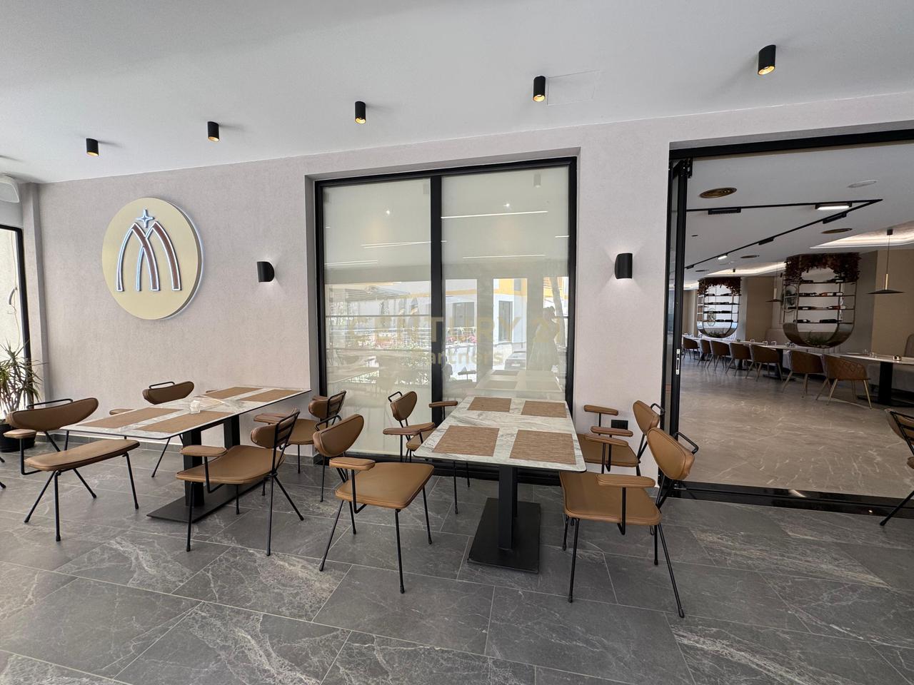 SHE'S A BAR-RESTAURANT IN QERRET!