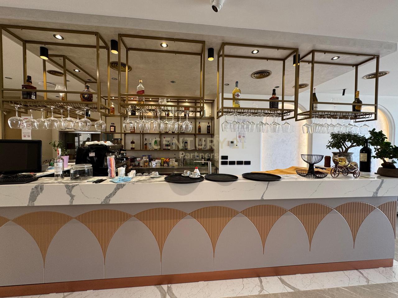 SHE'S A BAR-RESTAURANT IN QERRET!