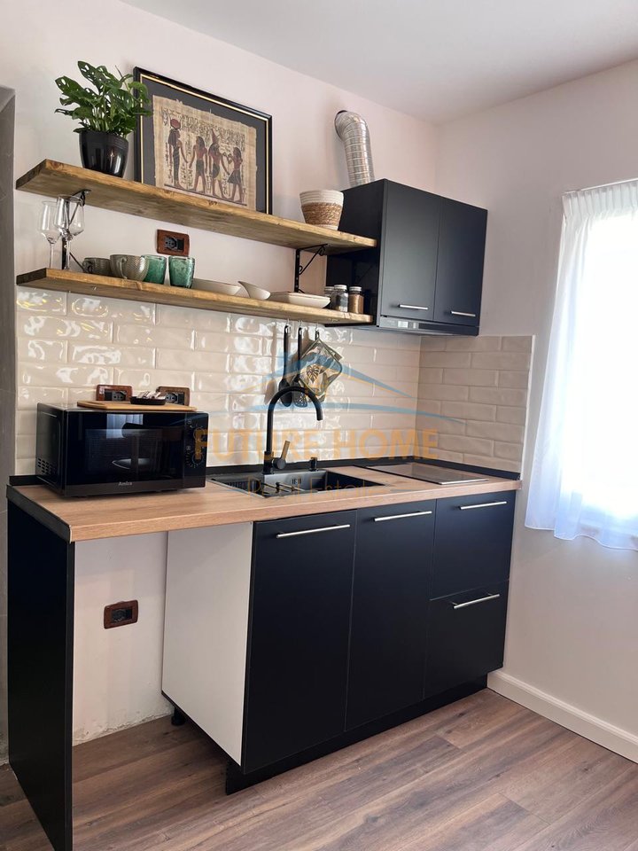 Qira, Garsoniere, 21 Dhjetori